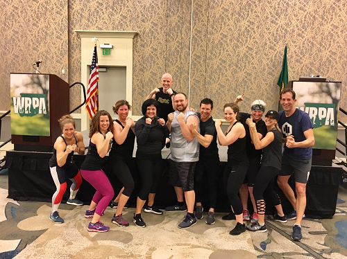 Conference Photo people flexing muscles in workout session group shot Conference Photo people flexing muscles in workout session group shot